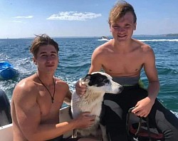 The magnificent Xander and Harry who found toobs in a cave after she swam 2.5 miles ashore