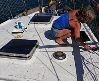 Bosun Nicky does a good job on the foredeck.