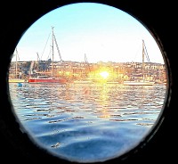 Falmouth at sunset through the porthole